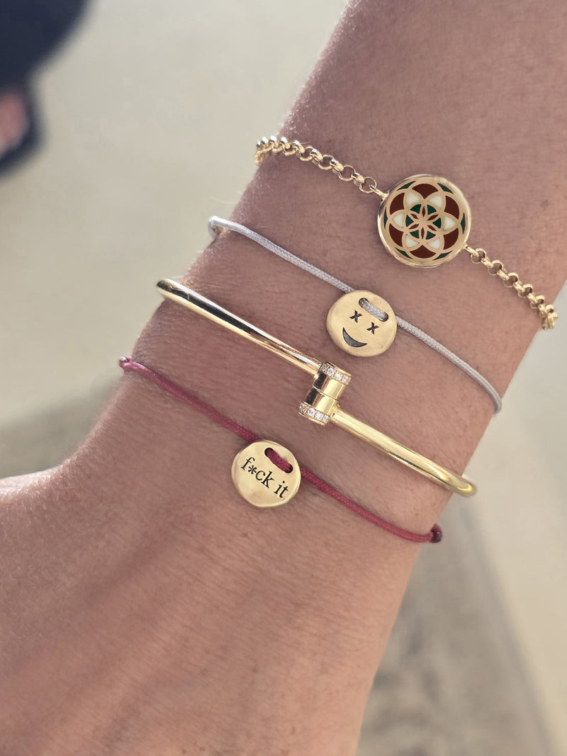 A Smiley Face Coin Rope Bracelet